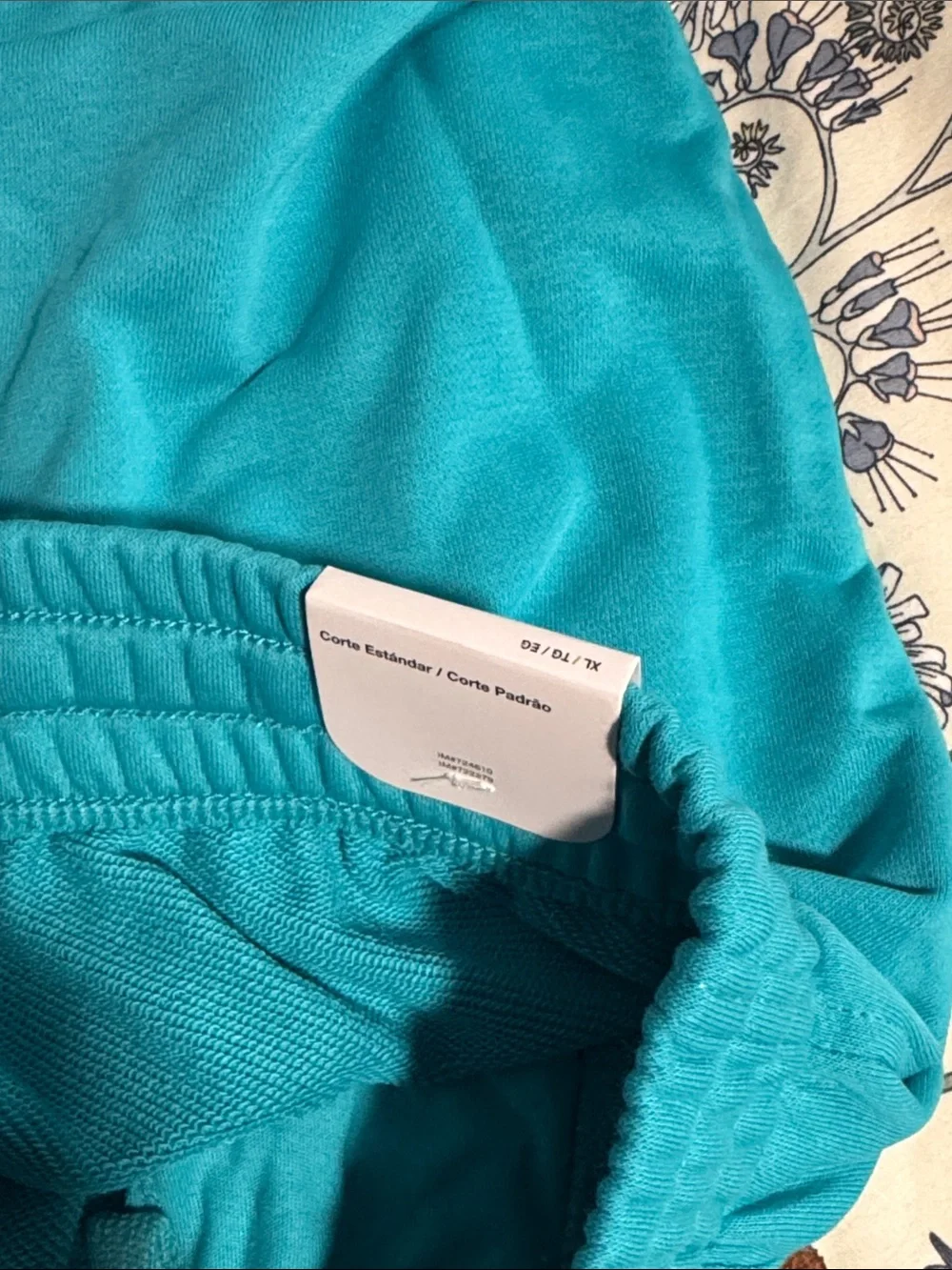 Nike Teal Athletic Shorts with White Swoosh